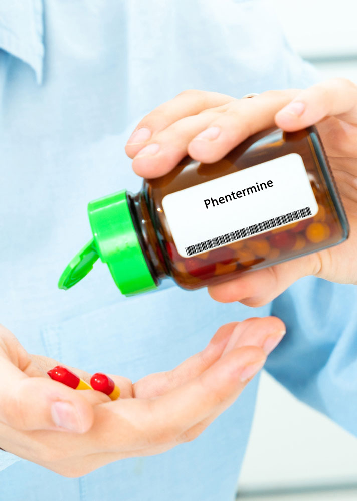 Phentermine,woman,hand,holding,on,open,palm,with,pill,tablets